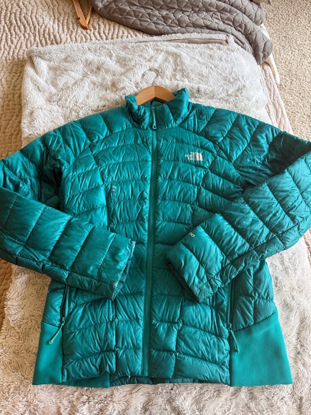The North face women’s teal puffer jacket